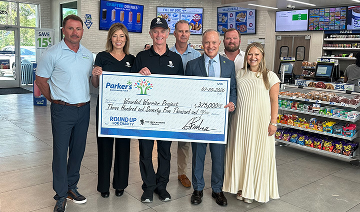 The Parker’s Kitchen Team presents WWP with a $375k check, raised from their 2026 round up campaign.