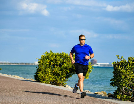 Warrior Andrew Harriman is jogging by the water.