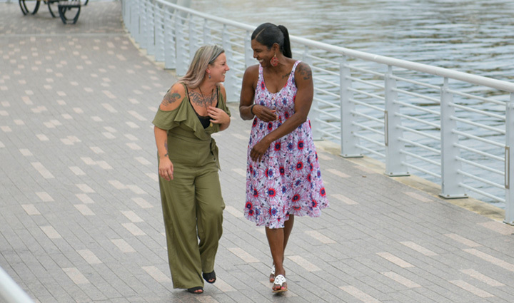 Warriors Jessica Coulter and Tonya Oxendine walking together by the water.