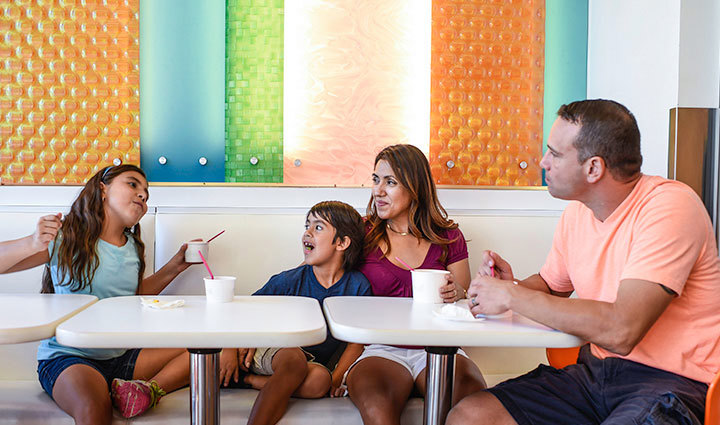 Warrior Bill Geiger sits at a booth with his wife and two kids, eating frozen yogurt.