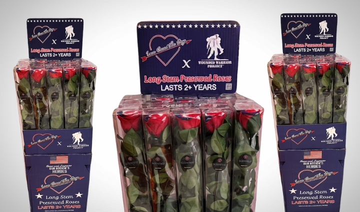 Three boxes of long-stem preserved red, white, blue roses. On box header is heart with Love Saves the Day next to WWP logo.