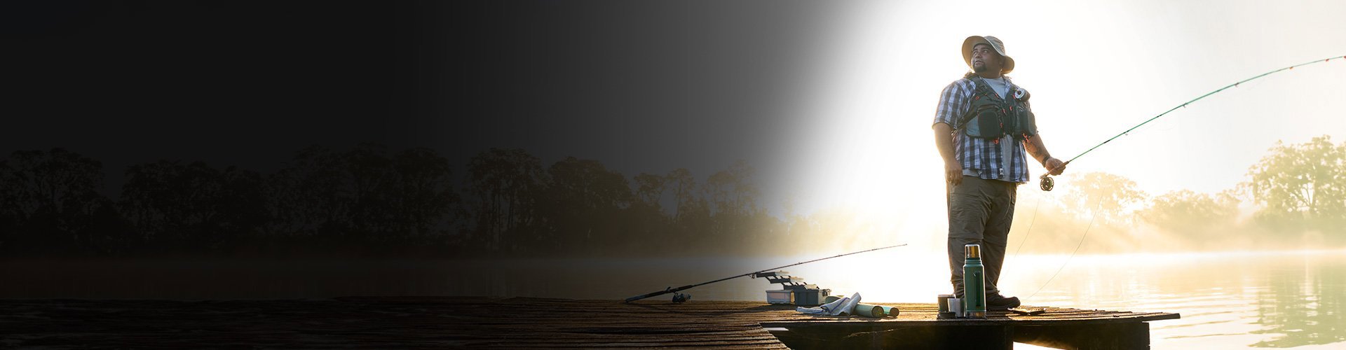 Wounded warrior Tim Aponte standing on a dock fishing.