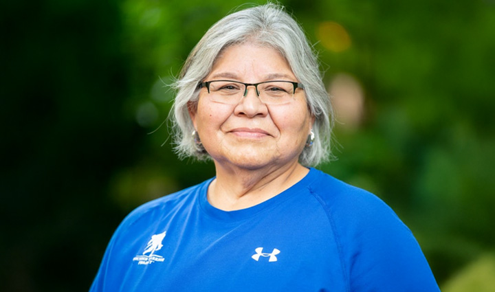 Headshot of gold star mother Mary Tallouzi wearing a blue WWP t-shirt.