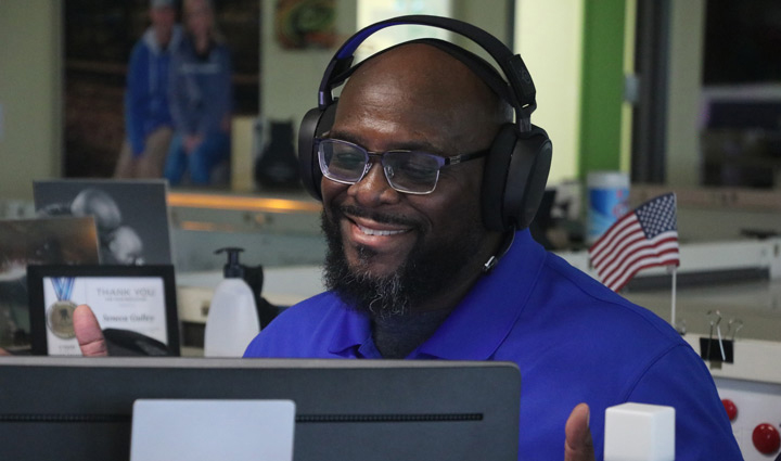 WWP teammate wearing headphones.