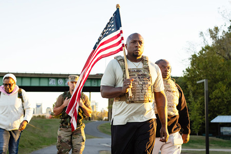 Melvin Gatewood, a Wounded Warrior Project Warrior, leading a weighted backpack walk with fellow veterans.